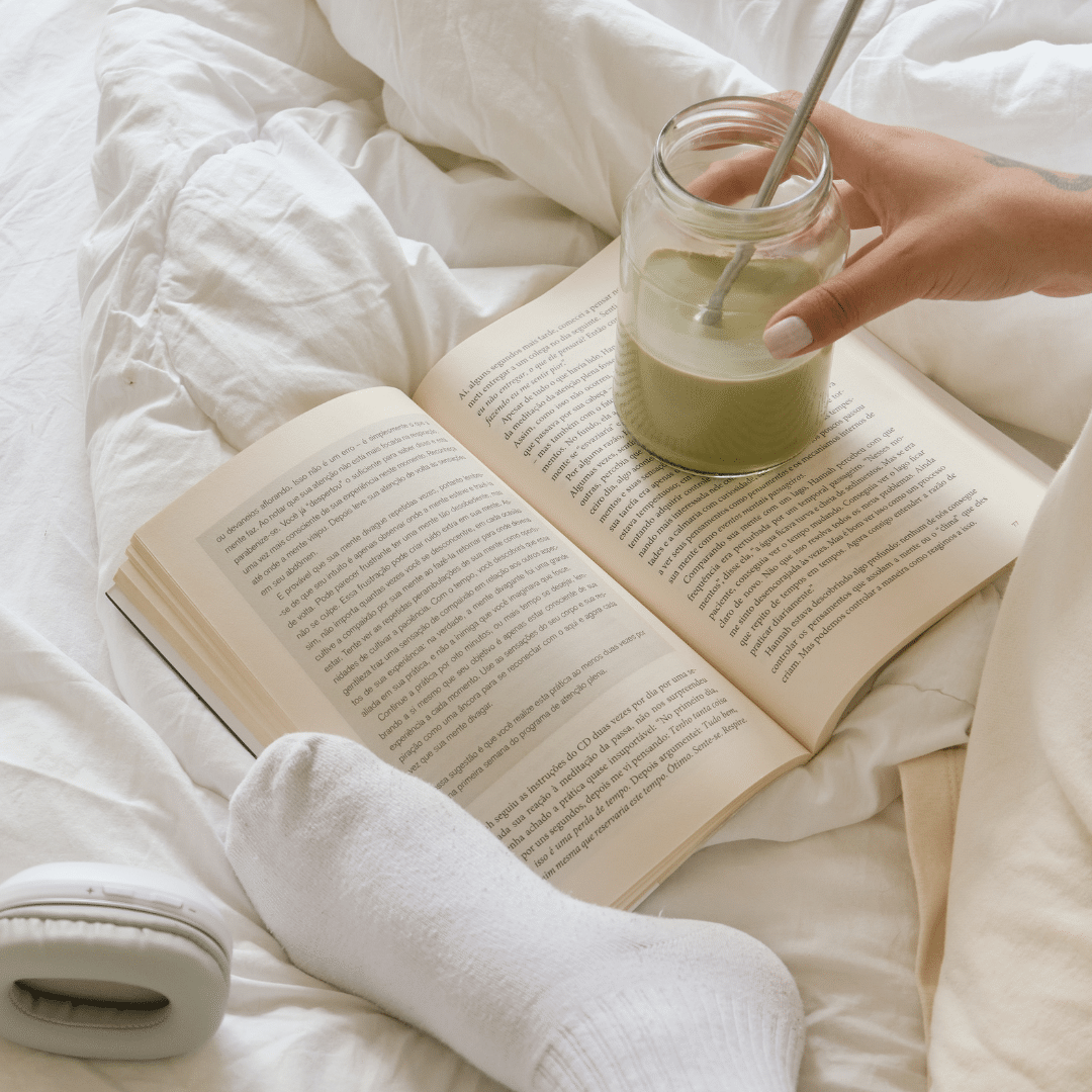 Image of someone relaxing and reading a book